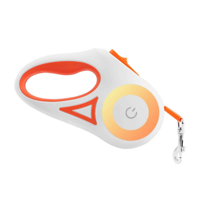 Laisse rétractable pour chiens avec collier automatique et lumières LED, main tenant le dispositif.