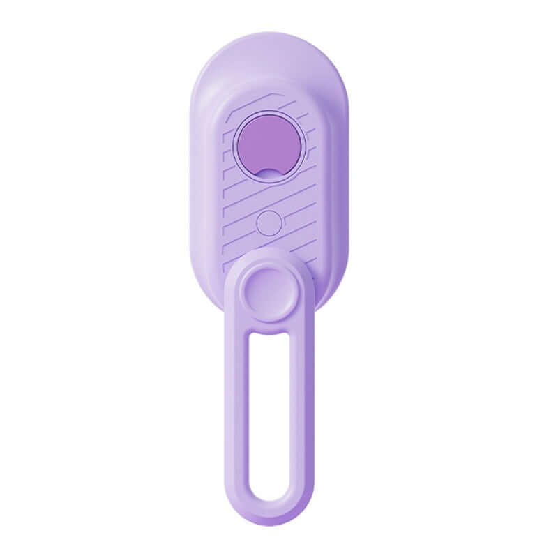 Brosse vapeur électrique pour animaux avec bouton et picots, idéale pour le toilettage et le retrait des poils.
